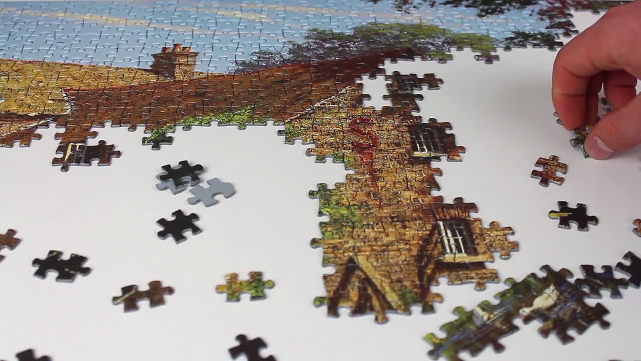 퍼즐 조각과 클로즈업의 손