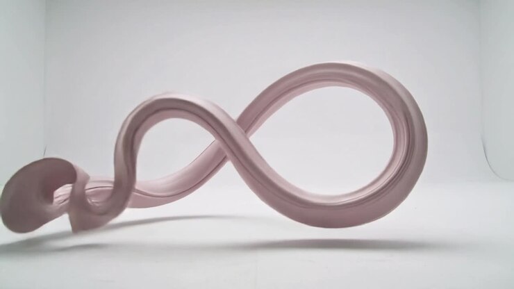 Playback starting, pink ribbon form moving inside lightbox, forming loops and S-shapes for design