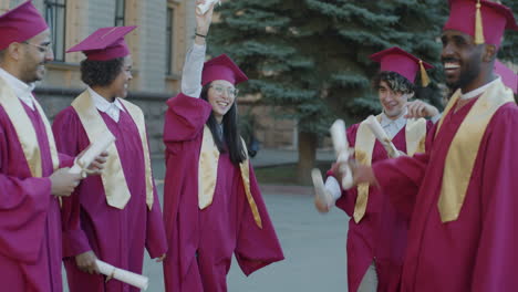 Group of diverse graduates celebrating graduation