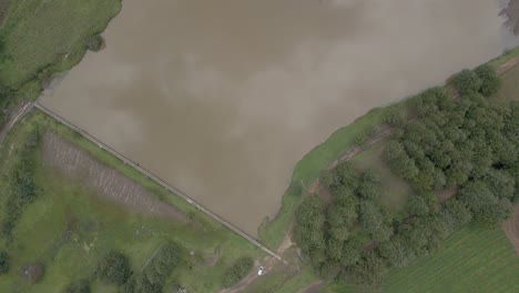 Aerial-Over-Aerial-Lake-water-with-clouds-reflections-in-sky-slow-motion