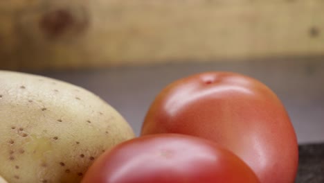 dolly in close up of carrots, green beans, potatoes and tomatoes