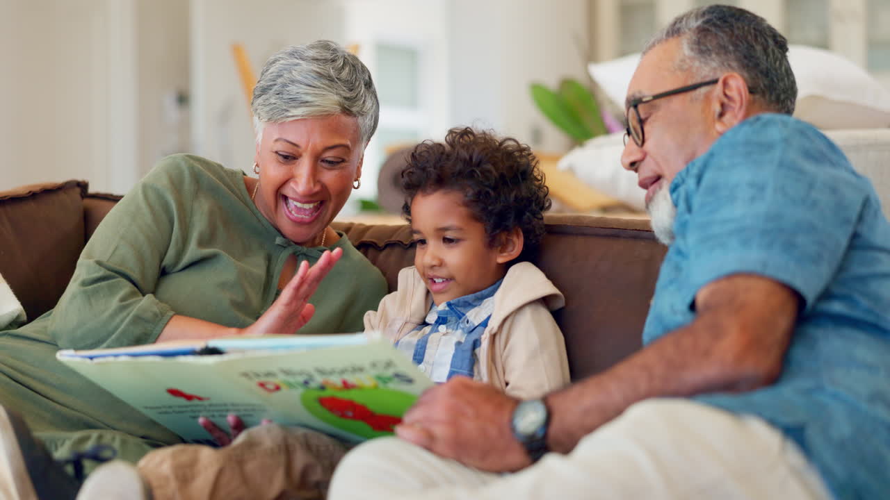Grandparents, child and high five for reading