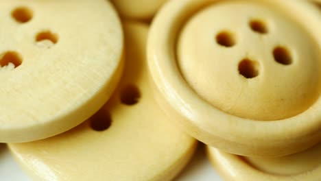 wooden  plastic buttons on white background ,