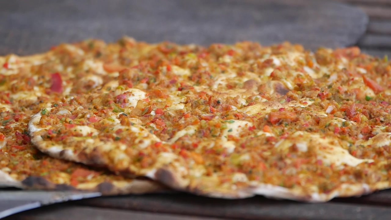 Traditional Turkish Lahmacun Flatbread with Savory Minced Meat Topping
