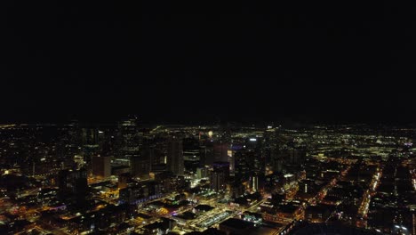 fireworks celebration exploding over downtown denver skyline buildings during nighttime