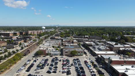 aerial view of a suburban town with chicago skyline in the background