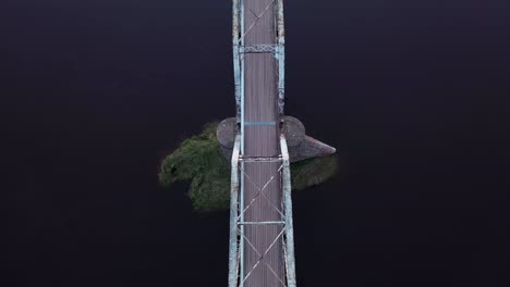 the iron bridge - aerial view of rusty truss bridge over gauja river near valmiera city in latvia, europe