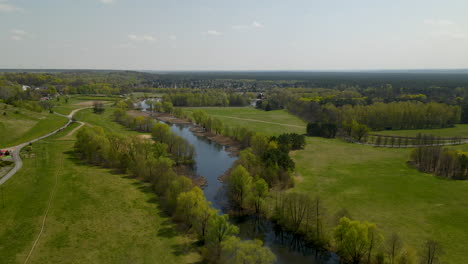 aerial view of myslecinek city park with path to walk around lake in bydgoszcz,poland