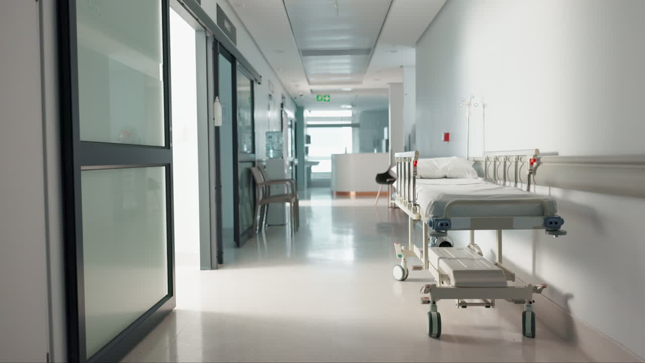 Healthcare, hospital and empty hallway with bed