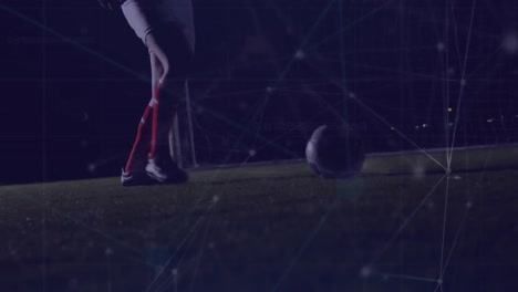 animación de puntos conectados sobre la sección baja del jugador de fútbol jugando con el fútbol en el suelo.