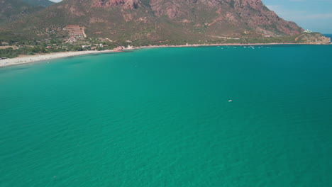 Panoramic-View-Of-Beautiful-Maritime-Landscape-With-Tropical-Blue-Sea-On-The-Costa-Smeralda-Of-Sardinia,-Italy---Aerial-drone-cinematic-shot