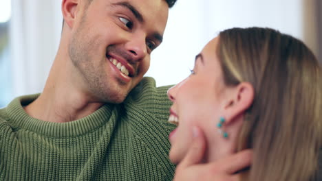 Happy,-love-and-couple-in-conversation-on-a-sofa