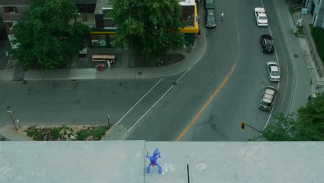 dancing toy at the edge of a building