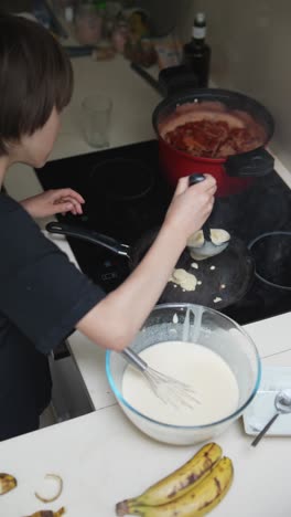 child making pancakes