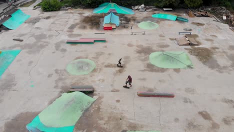 k drone video of skaters at outdoor skatepark