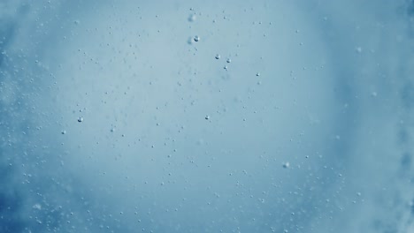 oxygen bubbles in water on a blue abstract background