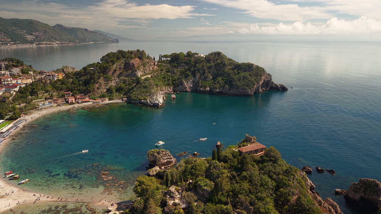 Aerial view rising above the stunning Isola Bella island lush islet near Taormina, Sicily