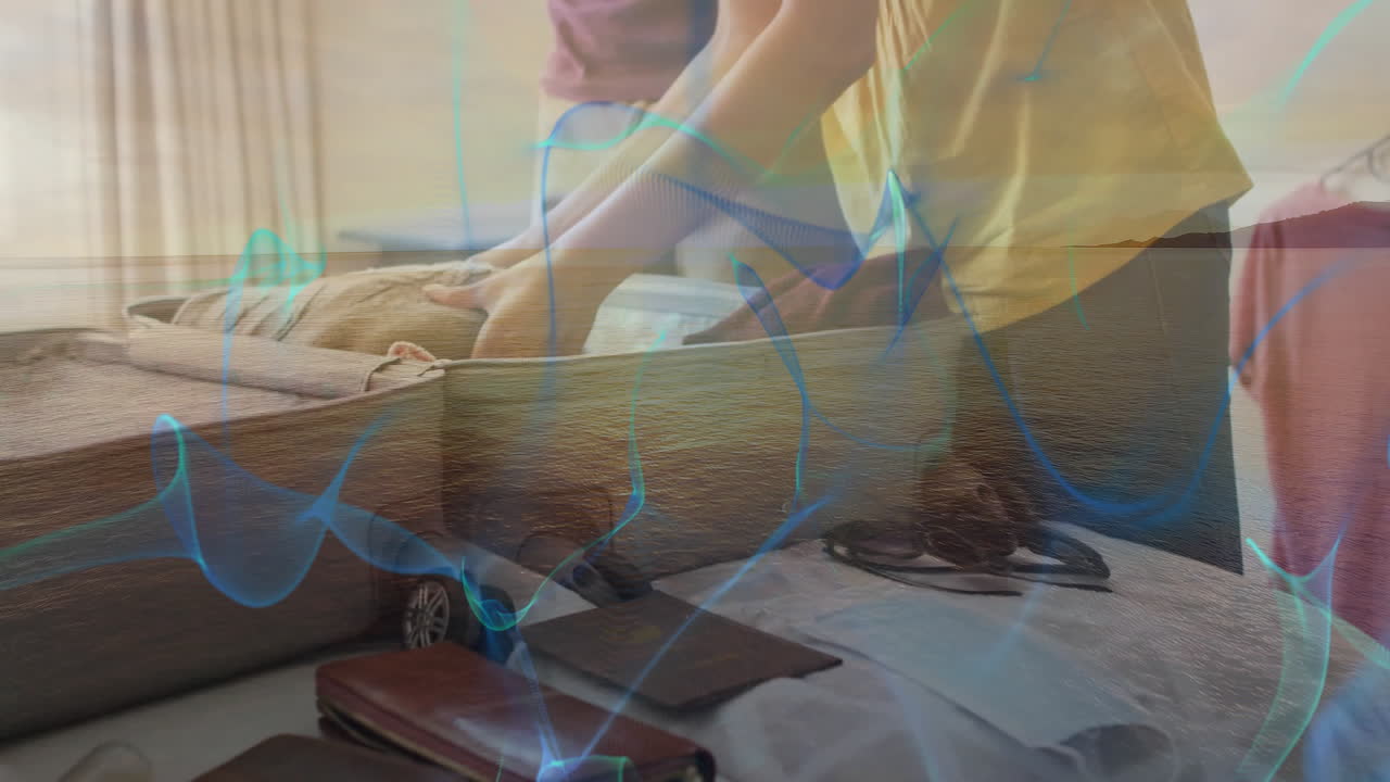 Packing suitcase at home with abstract blue wave animation overlay