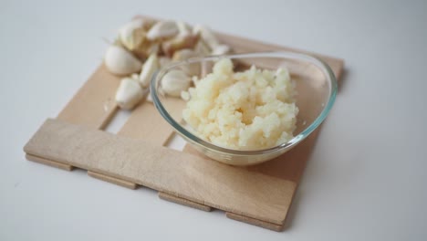 minced garlic in a glass bowl