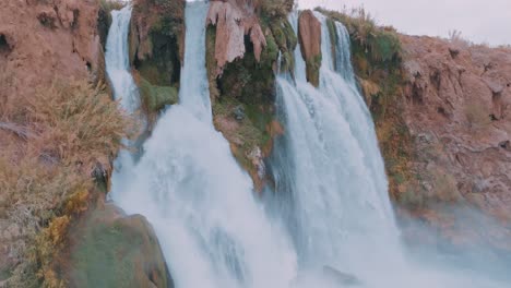 majestic waterfall cascading down rocky cliffs