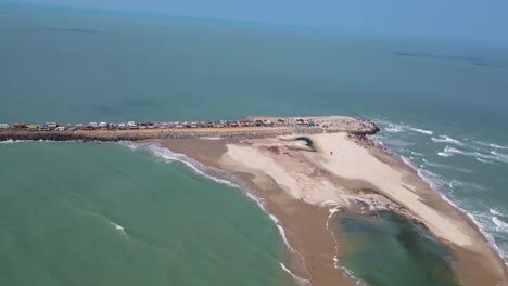 aerial drone shot of dhanushkodi’s last road, where the journey ends amidst scenic ocean views.
