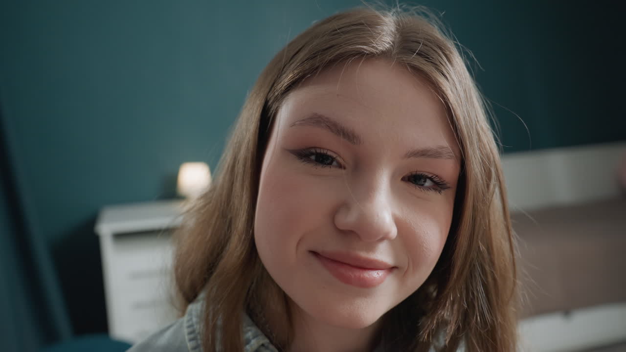 White teenage girl enjoying brush ritual, calm bedroom scene with soft lighting, preparing for audition, relaxed smile, natural makeup application, mirror reflection, gentle closeup capturing freckles