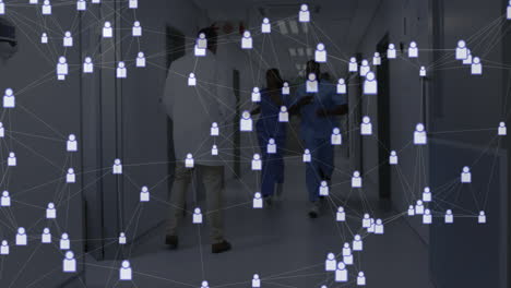 medical team running and walking down shiny hospital corridor, showing user-icon network overlay