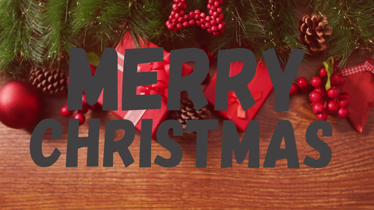 Merry Christmas text animation over Christmas decorations with gifts and pine cones