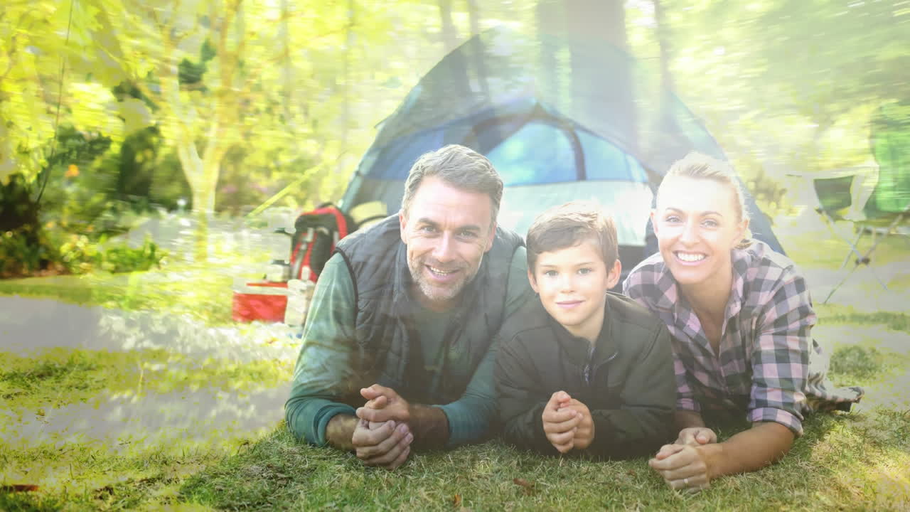 Family camping over animation of trees and sunlight in forest