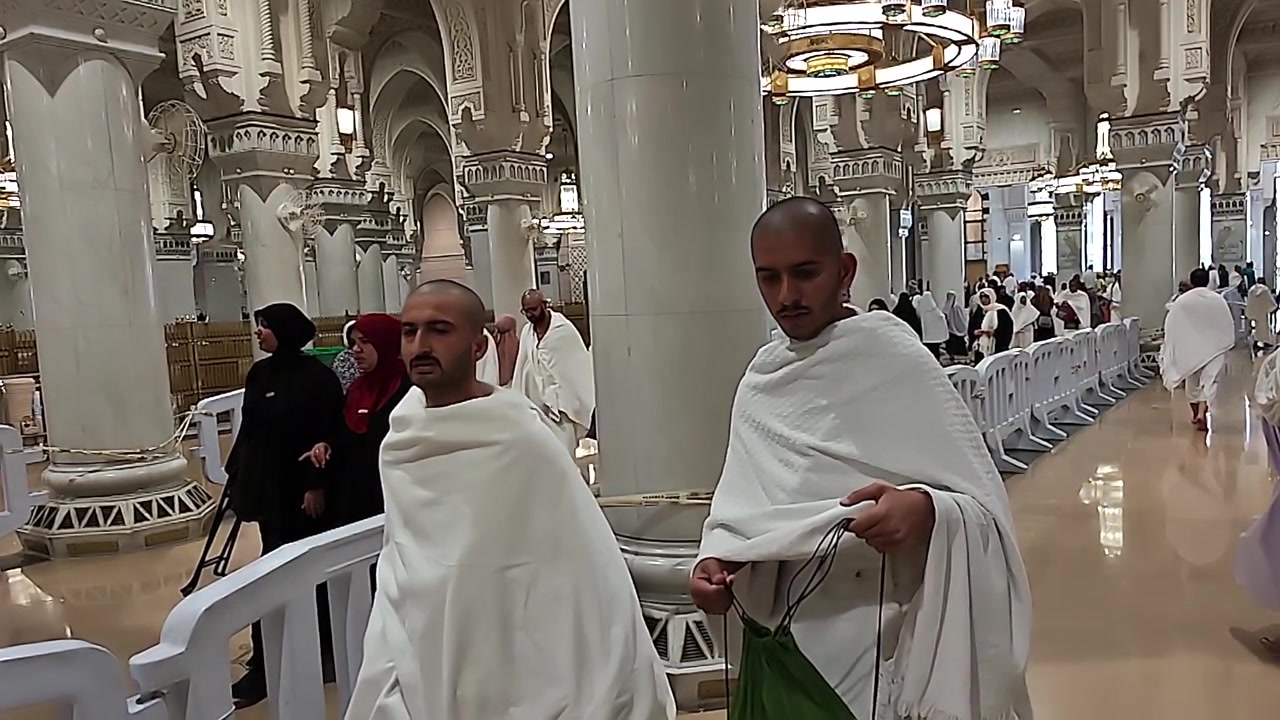 Pilgrims Walking Inside the Grand Mosque in Mecca