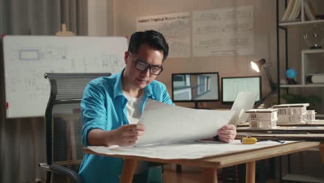 architect reviewing architectural plans