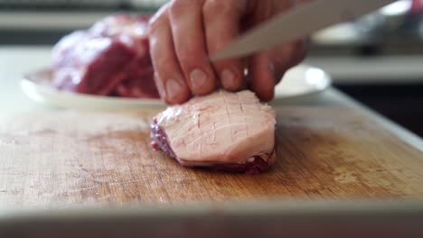 scoring fat on lamb rump meat cut with sharp knife