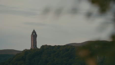 static shot of the national wallace monument standing on a hill near stirling, scotland