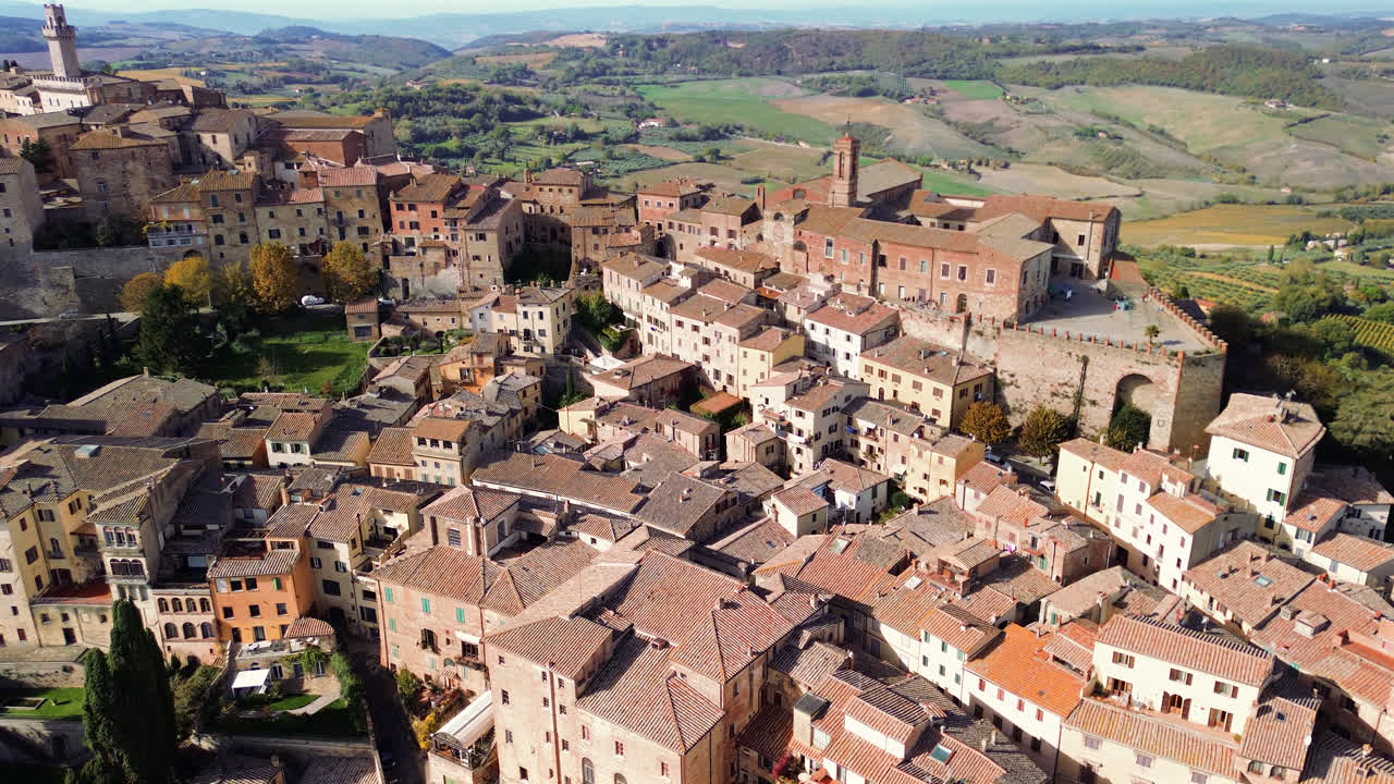 Drone above Tuscan rooftops compact medieval layout and italian renaissance town charm, panoramic