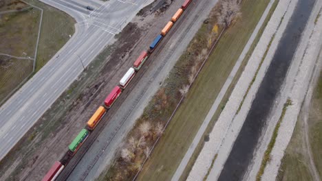 Drone-view-of-the-fully-loaded-train-in-Calgary-in-fall-season
