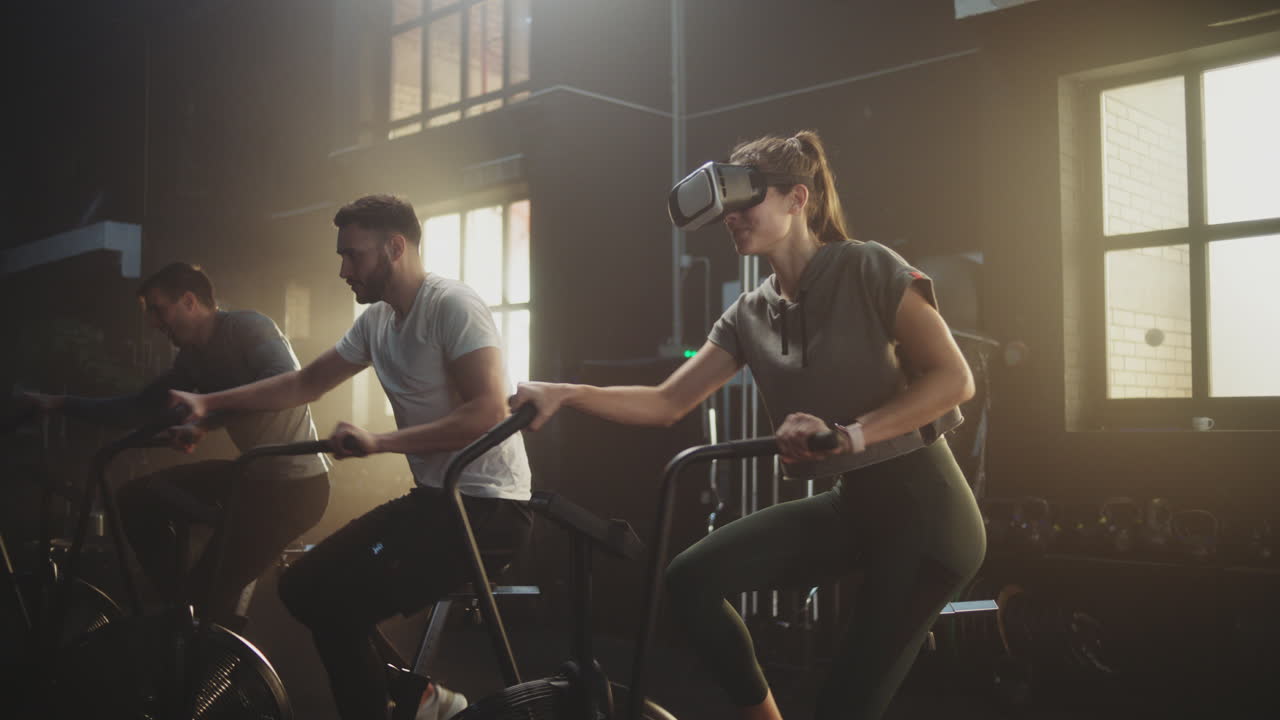 People Exercising in a Gym with VR Glasses