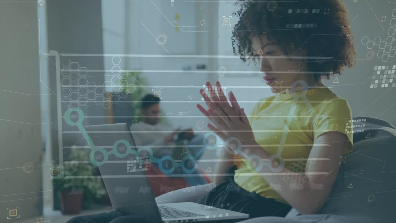 Animation of financial data processing over biracial businesswoman working in office