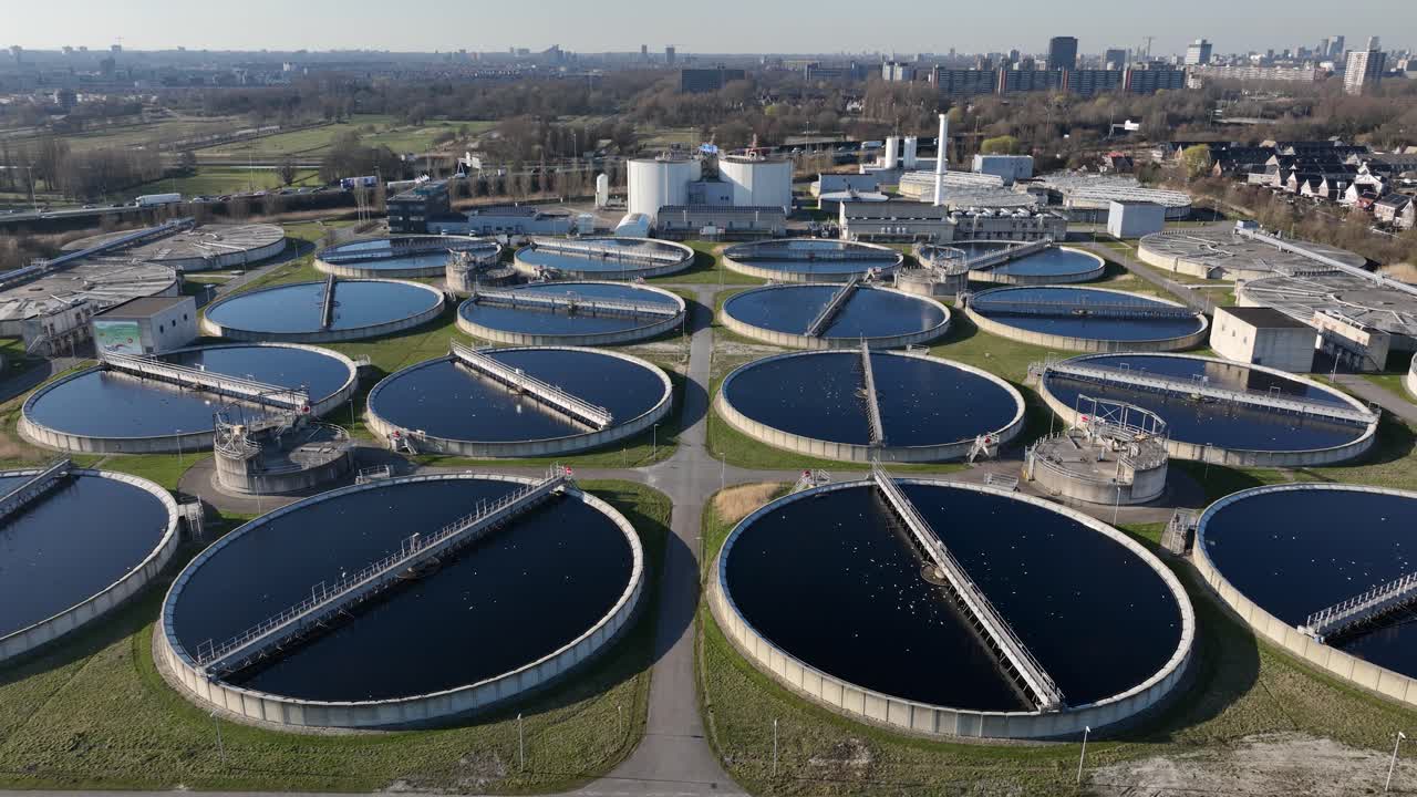 Cleaning of water, waste water treatment facility, purifying water. Aerial drone view.