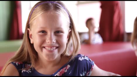 Portrait-of-schoolgirl-having-breakfast