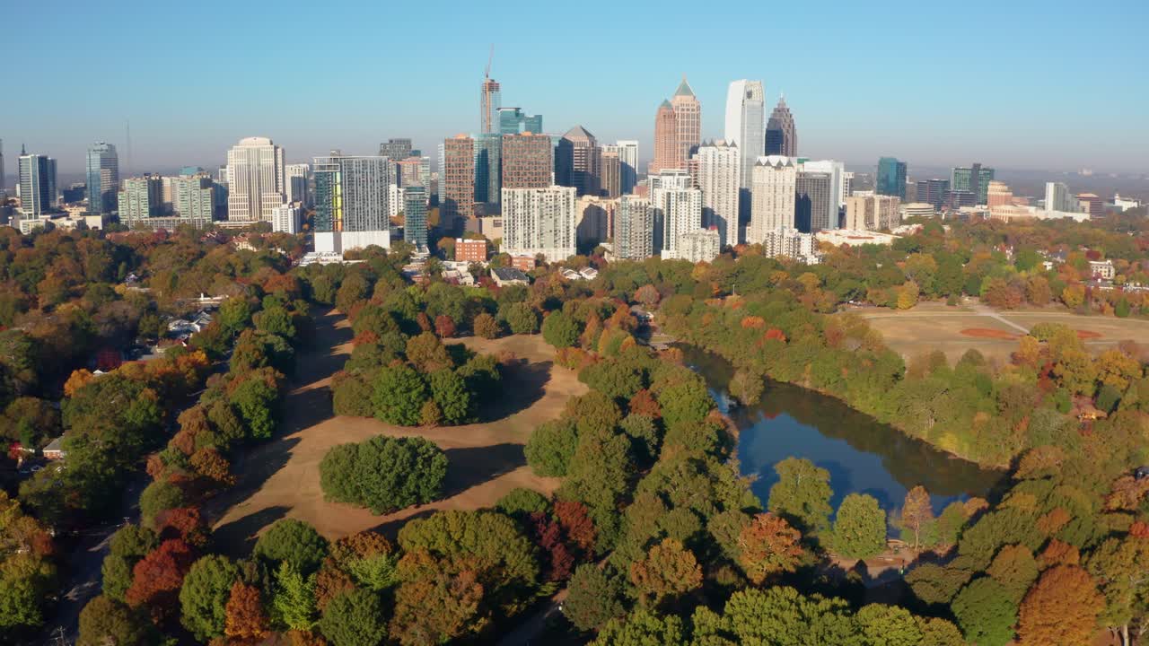 Flying high above Piedmont Park with lake and Fall colors overlooking Atlanta Georgia