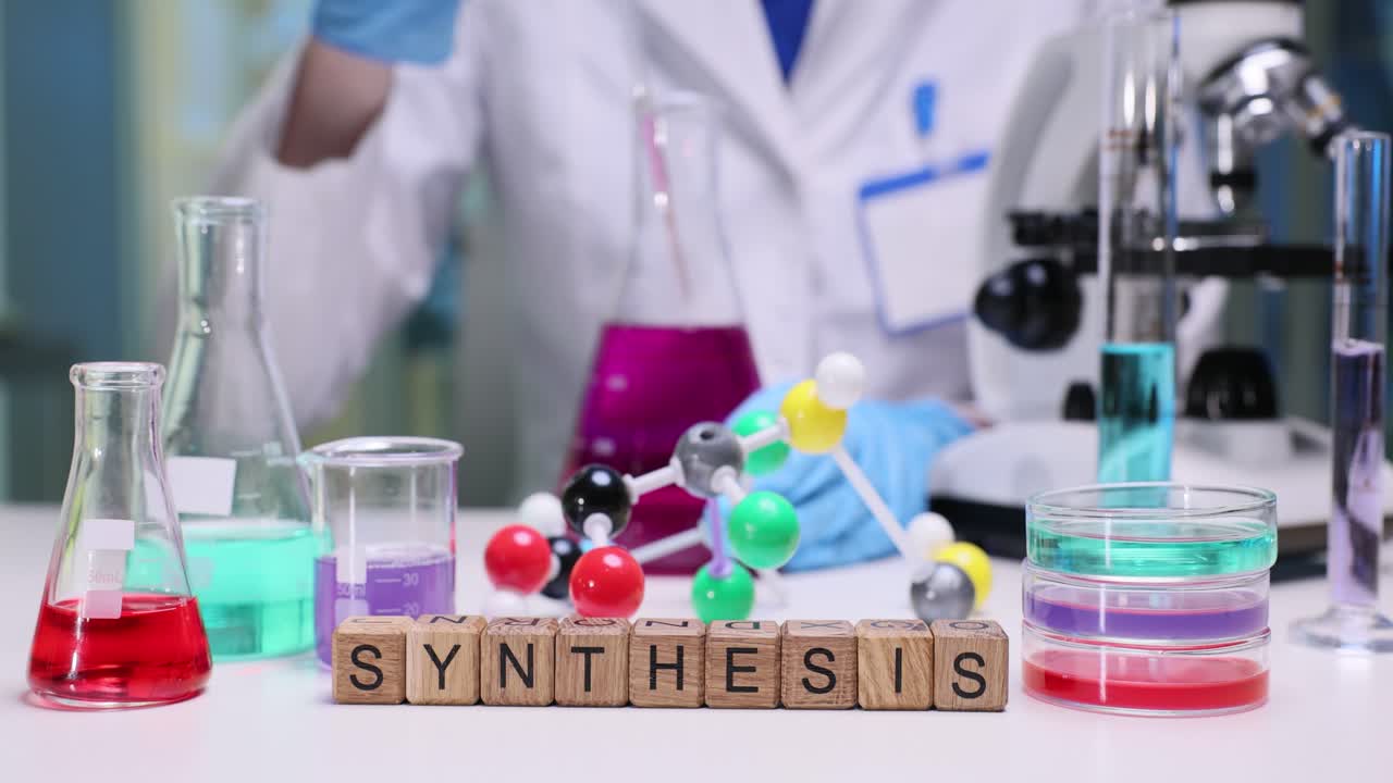 Chemical Synthesis Experiment in a Laboratory with Scientific Equipment and a Person