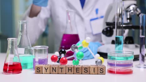 chemical synthesis experiment in a laboratory with scientific equipment and a person