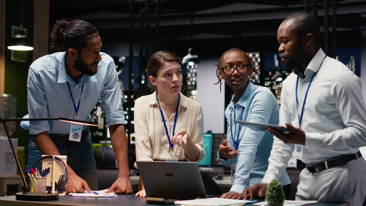 Corporate team gathered around office desk collaborating on project