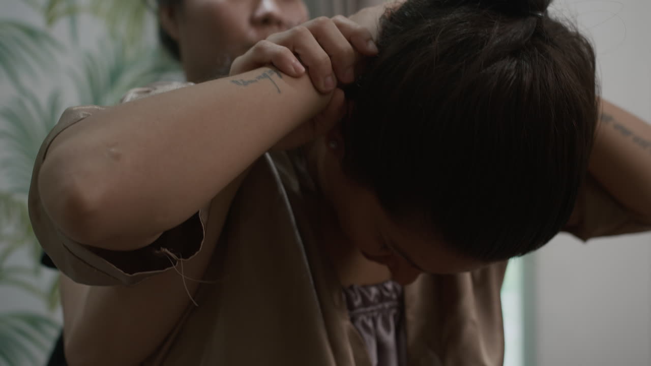 Caucasian Female Client Relaxing during Thai Massage Procedure