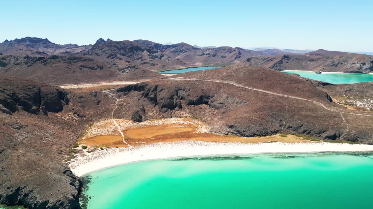 Stunning aerial view of Tecolotito beach, La Paz, with crystal-clear turquoise waters
