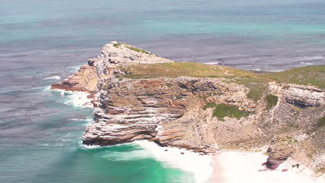 Western-Cape's-coast-park,-green-mountains,-sky,-stones-and-rocks,-walkways-and-Atlantic-Ocean-views-at-Cape-Point-in-Good-Hope-Reserve,-near-Cape-Town,-South-Africa