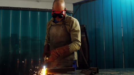 Welder-welding-a-metal