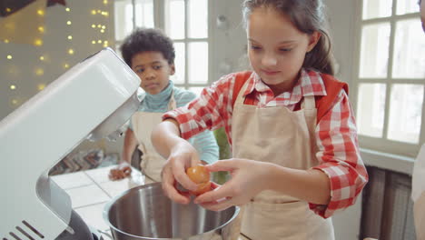 Girls-Adding-Eggs-to-Mixer-Bowl-on-Culinary-Masterclass