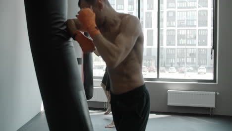 boxers training with punching bags