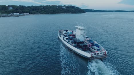 Aerial-Drone-shot-of-Ferry-approaching-Shelter-Island-North-Fork-Long-Island-New-York-before-sunrise